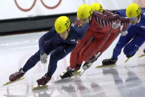 Apolo Anton Ohno (front) of the U.S in action during the short track speed skating 500 meters at the 2006 Turin Games.