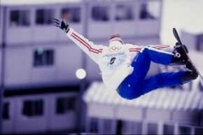 Jonathan Collomb-Patton of France competes in a snowboarding event during the Winter Olympics in Nagano, Japan. This was the first Olympics to feature snowboarding.
