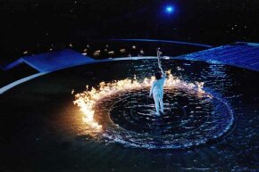 Cathy Freeman of Australia lights the cauldron with the Olympic flame during the opening ceremony of the Sydney Olympics. Freeman was the first torch bearer to also win a gold medal during the Olympics.