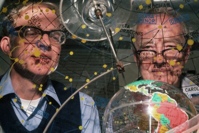 Father-and-son research team Luis and Walter Alvarez peer through a star dome, which shows the orbit and location, relative to Earth, of stars and constellations. The Alvarezes postulated that a giant asteroid or comet hit Earth millions of years ago, causing mass extinctions. © Roger Ressmeyer/Corbis
