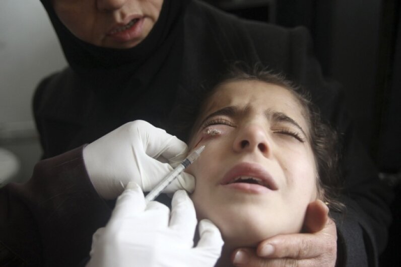 A Syrian child showing symptoms of leishmaniasis has her blood drawn in 2013. Scientist and doctor Jacinto Convit dedicated his life to researching infectious disease, particularly leprosy and leishmaniasis. © Muzaffar Salman/Reuters/Corbis