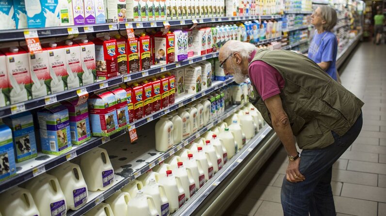 The difference in fat content between whole, 2 percent, 1 percent and fat-free milk may not be what you assume. Robert Nickelsberg/Getty Images
